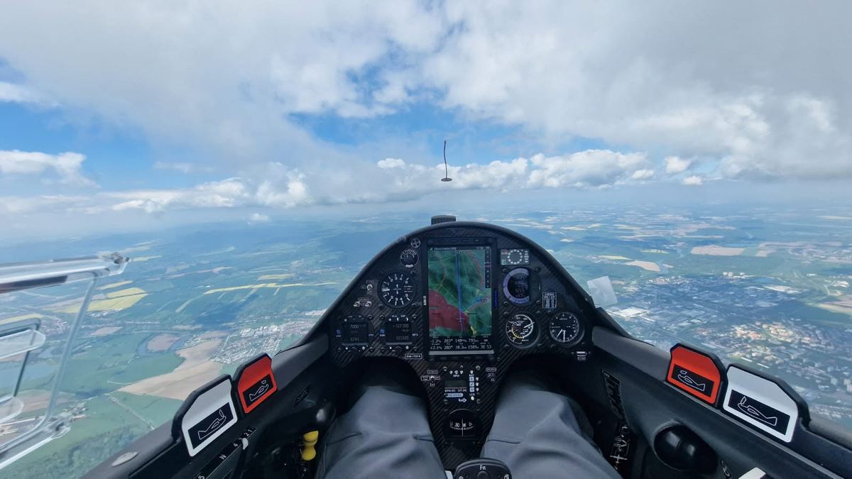 Instrument panel of a modern glider in flight beneath the clouds